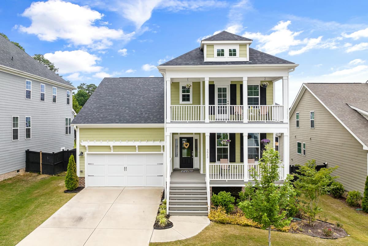 New suburban home exterior with garage, similar to new construction homes in Nocatee and World Golf Village